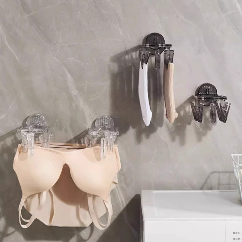 Suction cup folding clothes hanger with clip